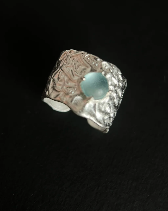 Angled view of the Azure Bloom blue stone statement ring