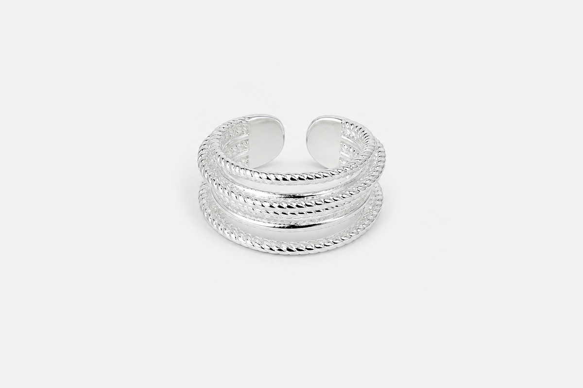 Silver layered cuff ring with textured multi-band design